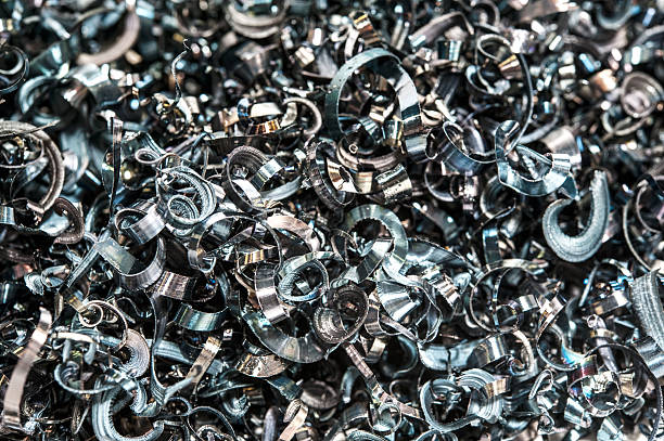 Closeup twisted spiral steel shavings. Drilling milling and lathe industry.